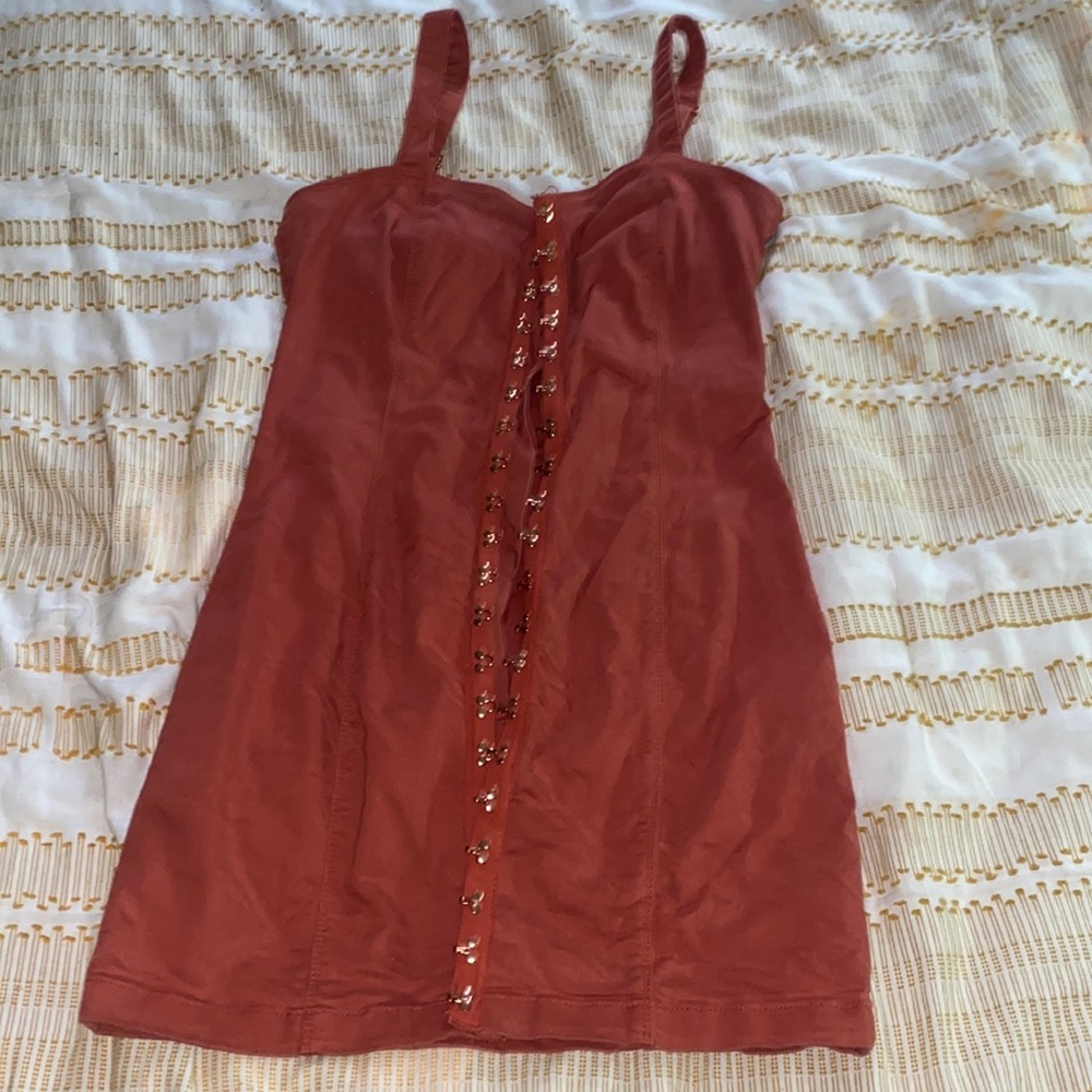 Orange dress with gold buttons